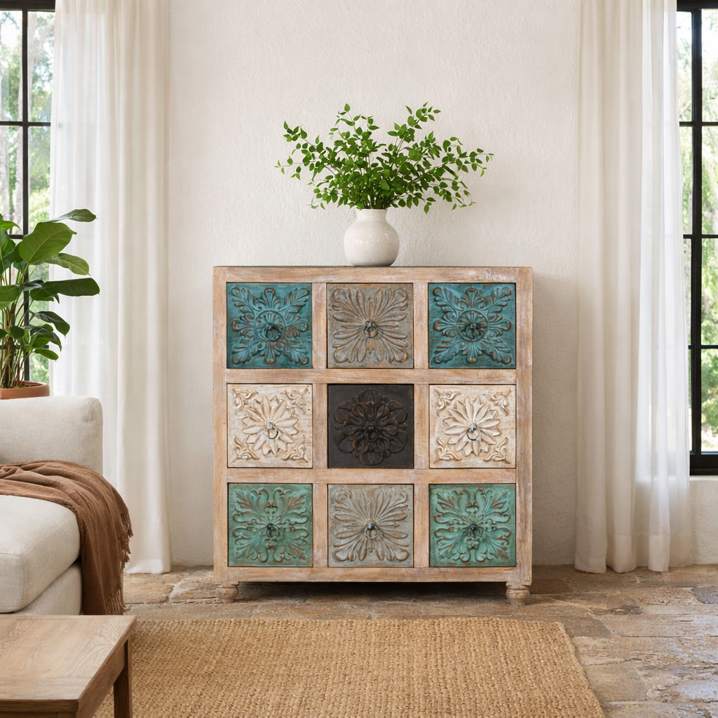Lifestyle imagination of a mango wood chest of drawers Hansika with nine hand-carved floral drawer fronts in soft bohemian colours. A unique carved sideboard combining artisan design with versatile storage.
