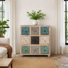 Lifestyle imagination of a mango wood chest of drawers Hansika with nine hand-carved floral drawer fronts in soft bohemian colours. A unique carved sideboard combining artisan design with versatile storage.