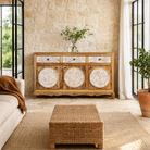 Lifestyle imagination o a hand carved wooden sideboard made from mango wood with floral carvings and curved base, mango wood furniture with storage, 150 × 40 × 95 cm.