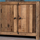 Close up image of a sustainable driftwood sideboard with two drawers, open shelf, and cabinets; made from reclaimed wood, 200 × 45 × 60 cm.