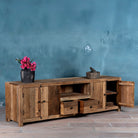 Side view with open drawers image of a sustainable driftwood sideboard with two drawers, open shelf, and cabinets; made from reclaimed wood, 200 × 45 × 60 cm.