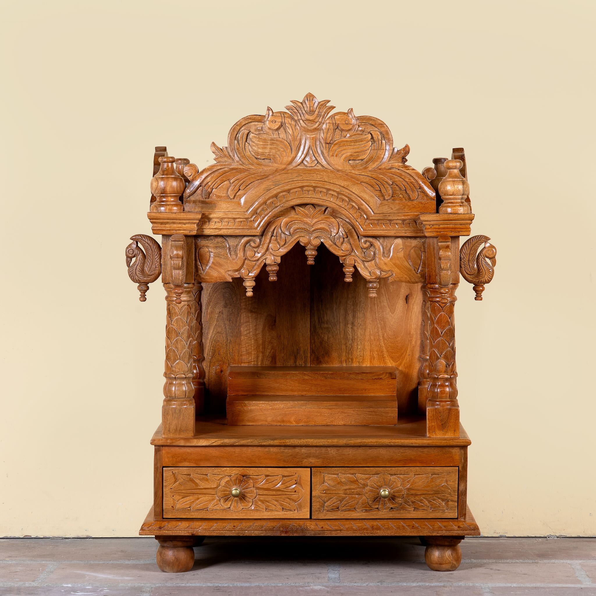 Meher hand carved mango wood mandir with traditional Indian temple details and two small drawers.