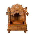 White background image of a Meher hand carved mango wood mandir with traditional Indian temple details and two small drawers.