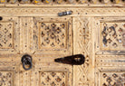 Close up image of a reclaimed Indian Damchya chest with carved wood panels and rustic finish – traditional Rajasthani furniture for vintage and heritage-inspired interiors.