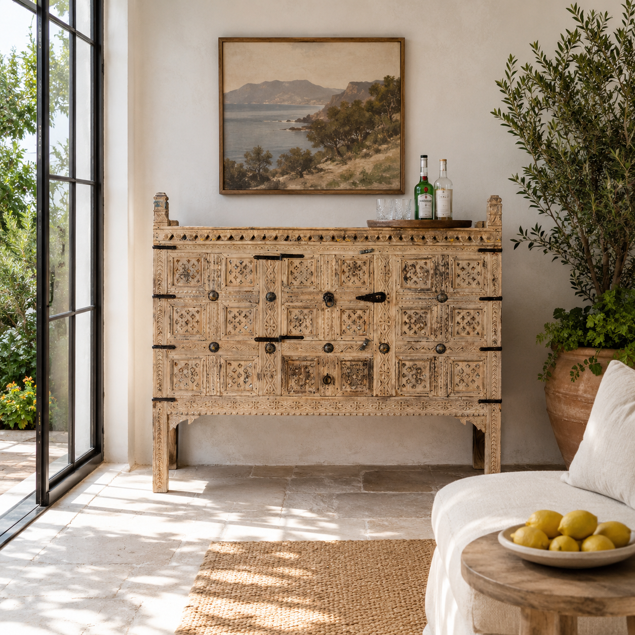 Lifestyle image of a reclaimed Indian Damchya chest with carved wood panels and rustic finish – traditional Rajasthani furniture for vintage and heritage-inspired interiors.