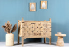 Side angle image of a reclaimed Indian Damchya chest with carved wood panels and rustic finish – traditional Rajasthani furniture for vintage and heritage-inspired interiors.