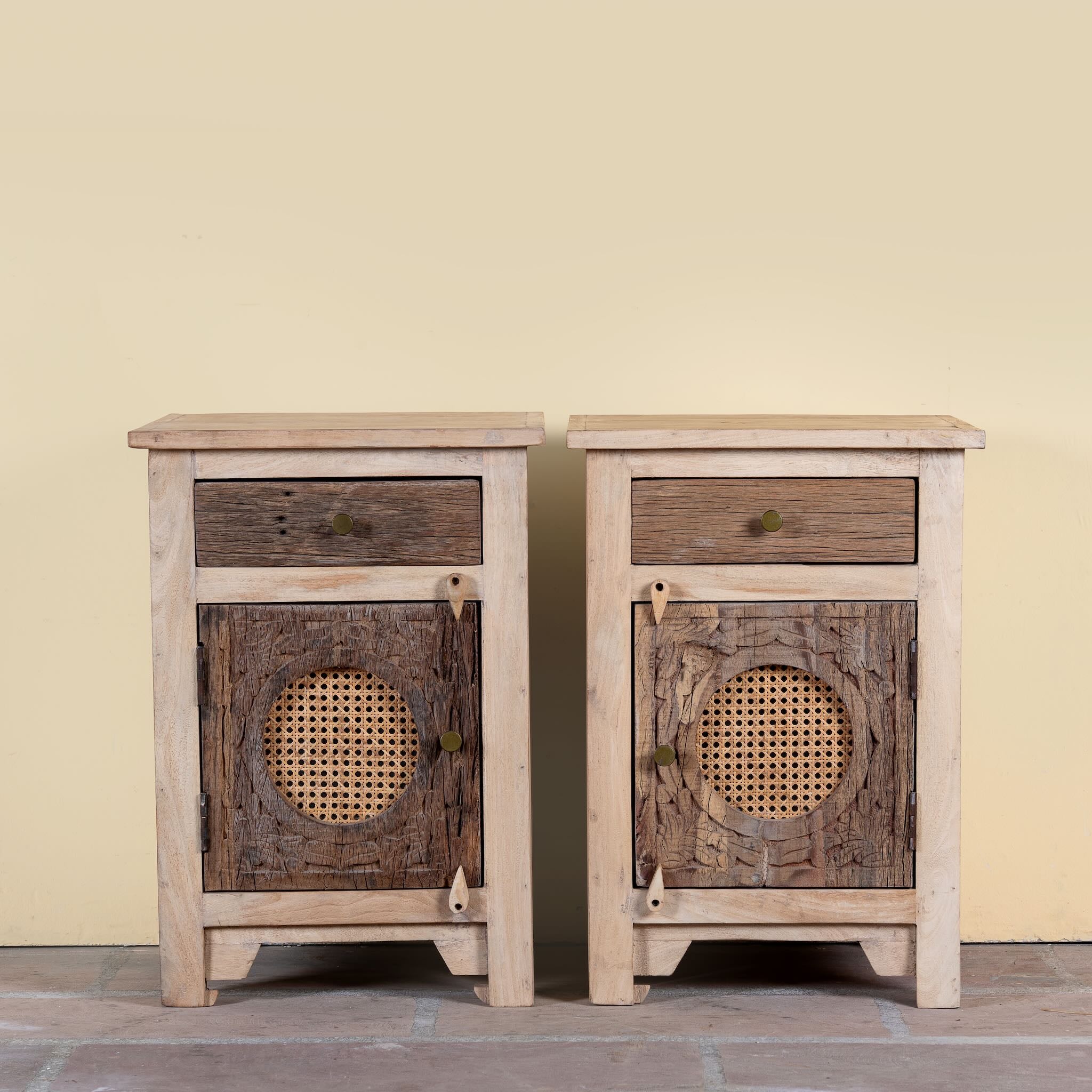 Milan hand carved reclaimed wood nightstands with woven rattan inserts, drawer storage, cabinet doors, and warm natural boho style design.