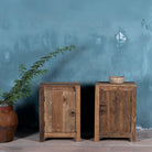 Reclaimed wood bedside table with single cabinet door – handcrafted driftwood furniture ideal for rustic minimalism and natural interior styling.
