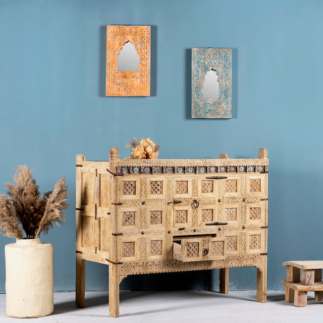 Side angle image with open drawer of a vintage entryway table treasure chest in antique Indian furniture style, solid teak wood with iron accents and sandblasted finish, 113 × 54 × 100 cm.
