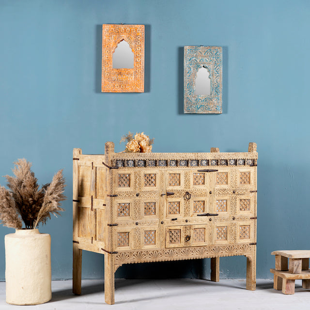 Side angle image of a vintage entryway table treasure chest in antique Indian furniture style, solid teak wood with iron accents and sandblasted finish, 113 × 54 × 100 cm.