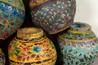 Mixed designs of hand-painted papier-mâché vases from India with floral folk-art designs in vibrant mixed colours. Unique Indian decor and decorative art objects handcrafted using traditional methods.