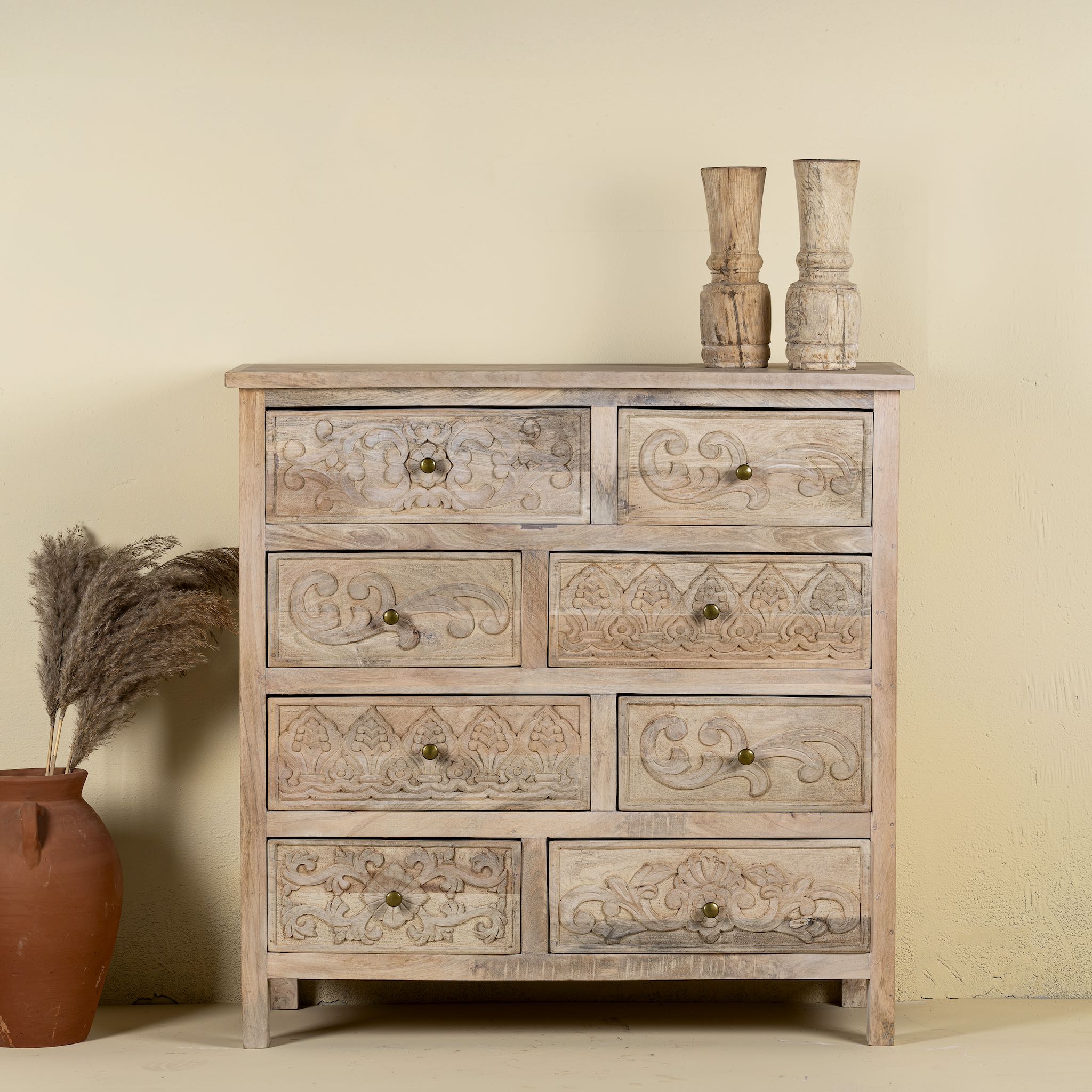 Carved mango wood cabinet with drawers and one door, made from reclaimed teak, 100 × 40 × 100 cm.