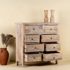 Open drawers image of a carved mango wood cabinet with drawers and one door, made from reclaimed teak, 100 × 40 × 100 cm.