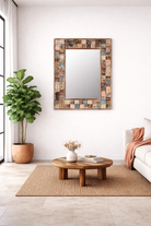 Lifestyle imagination of a of a rectangular mango wood mirror with reclaimed wood patchwork frame and distressed finish; perfect for vintage home decor and bohemian styling, 64 × 5 × 84 cm.