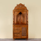 Moksha hand carved mango wood mandir with decorative Indian carvings, drawers, and cabinet storage.