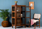 Side angle image with open doors of a compact reclaimed teak wood display cabinet with two glass doors and shelving – sustainable teak wood furniture combining functional design and unique character.