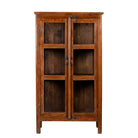 White background image of a compact reclaimed teak wood display cabinet with two glass doors and shelving – sustainable teak wood furniture combining functional design and unique character.