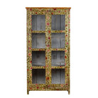 White background image of a hand-painted reclaimed wood cabinet with glass doors and floral motifs – sustainable and artistic furniture for vintage or bohemian interiors.