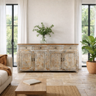 Lifestyle image of a living room furniture sideboard made from hand-carved mango wood, vintage style furniture with sunburst patterns and distressed finish, 180 × 40 × 90 cm.