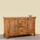 Side angle image of a Naren Natural hand carved mango wood sideboard with floral carved doors 150cm