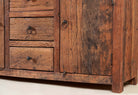 Close up image of a storage rustic sideboard made of reclaimed wood with 3 drawers and 2 doors.