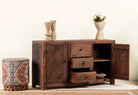 Side angle image with open doors of a storage rustic sideboard made of reclaimed wood with 3 drawers and 2 doors.