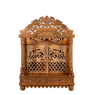 White background image of a and carved mango wood Indian mandir temple with ornate floral carvings, lattice doors, and two storage drawers.