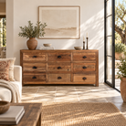 Lifestyle image of a Nayel reclaimed wood chest of 9 drawers with dark metal cup handles in Japandi style, 180cm