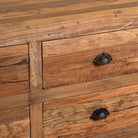 Close up image of a Nayel reclaimed wood chest of 9 drawers with dark metal cup handles in Japandi style, 180cm