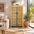 Lifestyle image of a Nehrika hand painted reclaimed wood cabinet with colourful floral double doors and three storage compartments, 150cm