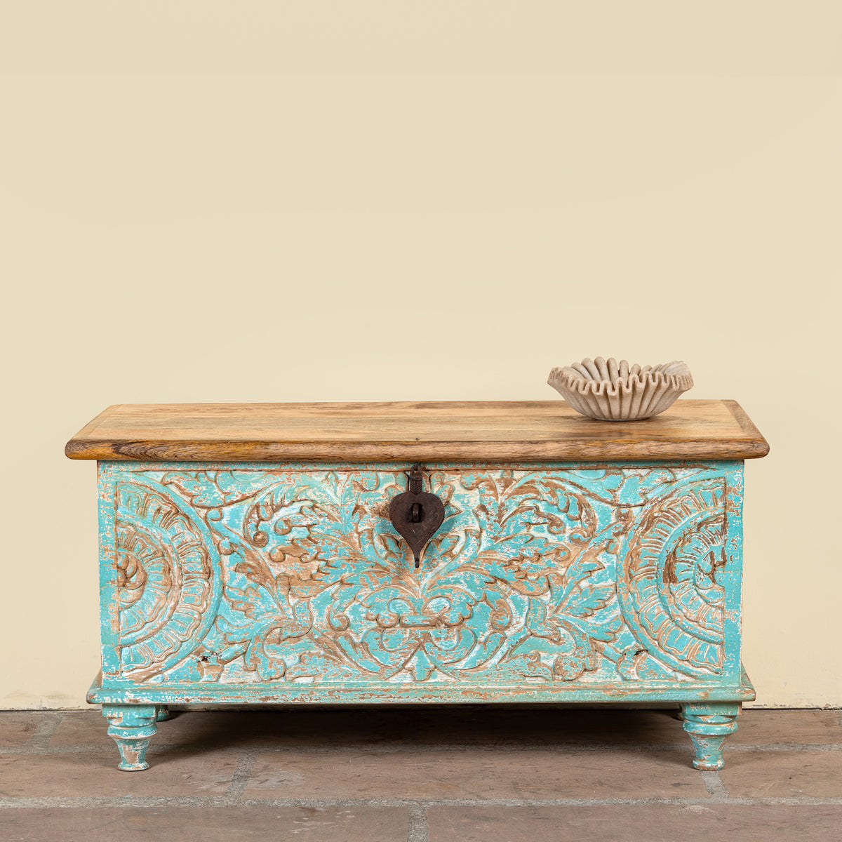 Neysa hand carved mango wood chest coffee table with turquoise floral design, natural wood top and iron lock, 90cm wide