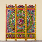 Hand carved and hand painted mango wood room divider with colourful floral Indian motifs and folding panels.