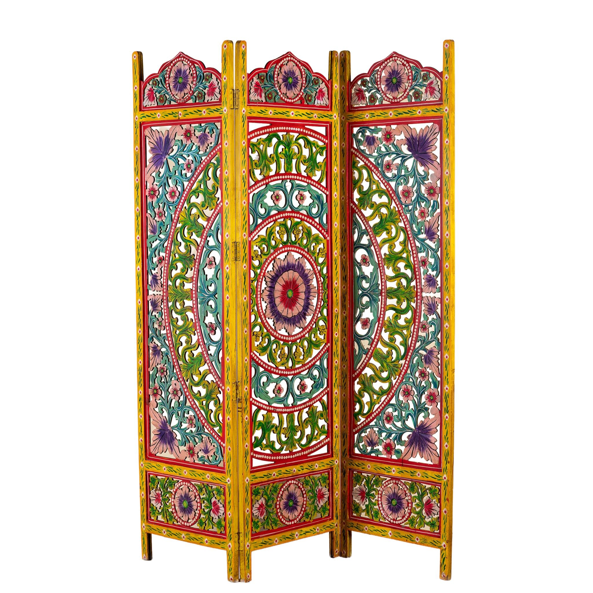 White background image of a hand carved and hand painted mango wood room divider with colourful floral Indian motifs and folding panels.