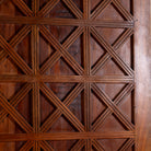 Close-up of a wooden panel with geometric lattice pattern