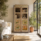 Lifestyle image of a Nirav hand painted reclaimed teak display cabinet with floral, peacock, elephant and leopard motifs 190cm