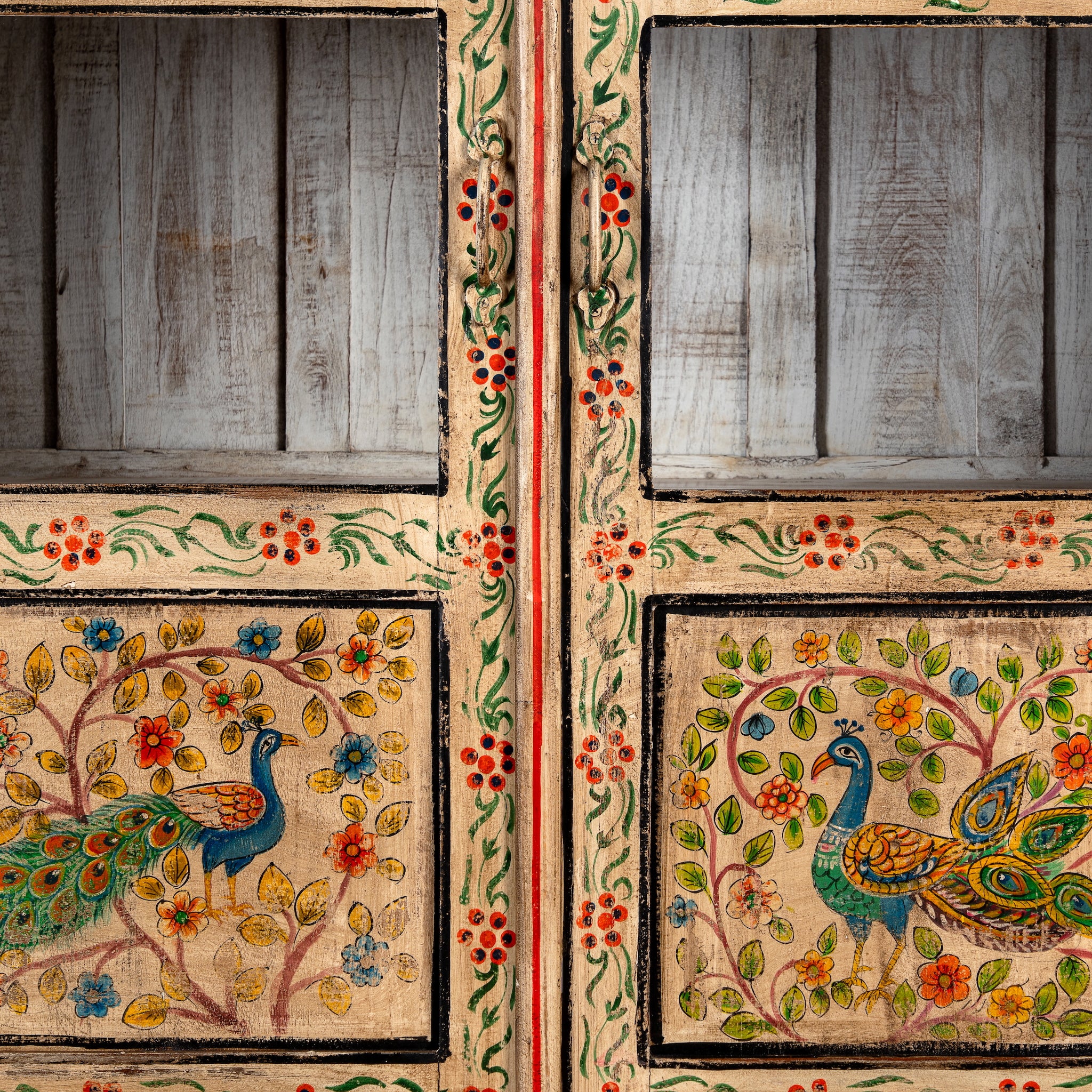 Close up image of a Nirav hand painted reclaimed teak display cabinet with floral, peacock, elephant and leopard motifs 190cm