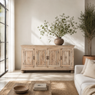 Lifestyle scene with a hand-carved mango wood sideboard with sandblasted finish – a rustic mango wood furniture piece ideal for Ibiza style interiors.