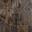 Close up image of a black wooden cabinet with handcrafted copper inlays and nickel-plated metal base—an artisanal furniture piece with a refined minimalistic style.