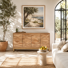 Lifestyle image of a handcrafted mango wood sideboard with star-carved doors and brass-plated iron stand—an artisanal furniture piece blending minimalistic and rustic design elements.