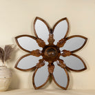 Round mango wood mirror Ojis with hand-carved floral frame. A unique wall decor piece combining traditional Indian craftsmanship and organic design.