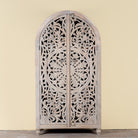 Image of a hand-carved mango wood wardrobe, a statement piece of bedroom furniture ideal for a bohemian interior.
