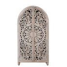 White background image of a hand-carved mango wood wardrobe, a statement piece of bedroom furniture ideal for a bohemian interior.