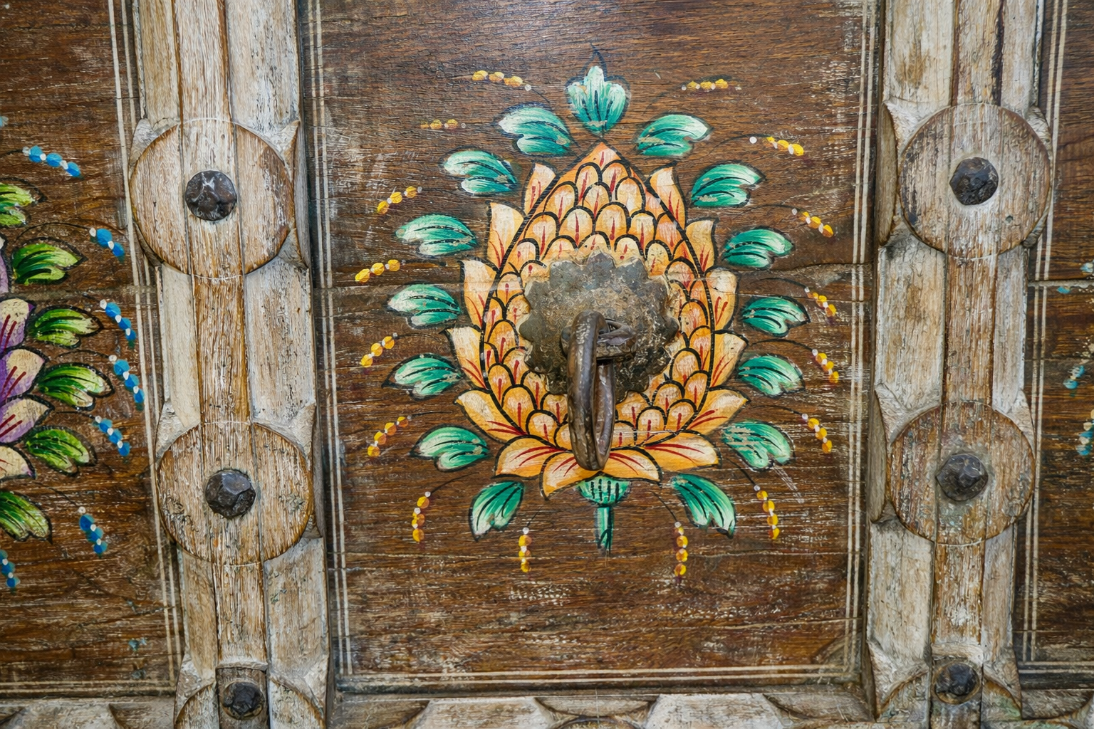 Close up image of a teak wood console table made from recycled antique house parts with hand-painted front; sustainable furniture, 183 × 85 × 42 cm.