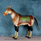 Large hand-painted decorative horse sculpture made of sheet metal in vibrant Rajasthani style, featuring intricate floral and geometric patterns in red, green, and black. Ideal for enhancing entrance areas, restaurant lobbies, hotel receptions, or luxury interior spaces.
