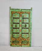 Antique Indian teak door hand-painted with floral and geometric motifs, distressed mint-green frame, vintage wall panels and vintage home decor.