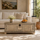 Lifestyle image of a hand-painted reclaimed wood chest box with Indian motifs – vintage home decor and versatile storage with coffee table function.