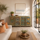 Lifestyle image of a Pavan hand-painted reclaimed wood sideboard with original Indian teak doors and colourful tiger, camel, elephant, horse and lion motifs 193cm