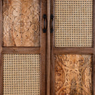 Close up image of a tall mango wood furniture cabinet with hand-carved details and woven rattan doors, artisan rattan furniture, 90 × 40 × 180 cm.