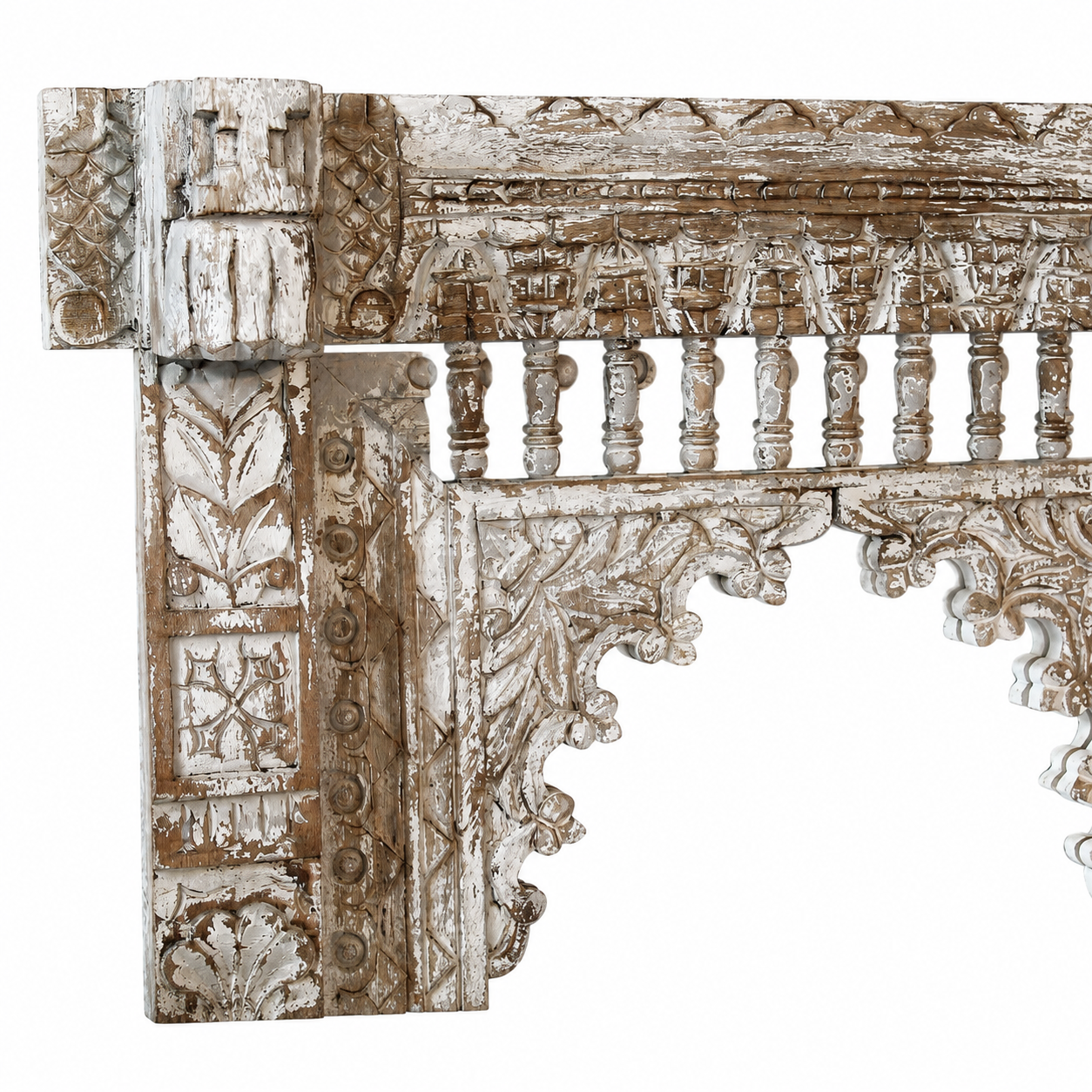 Close up image of a hand‑carved mango wood mirror Persia with floral wooden frame. A bold piece of carved wooden mirror and unique wall decoration for vintage and bohemian interiors.