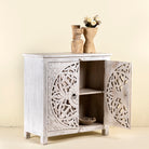 Open door image of a white carved wood cabinet made from solid mango wood with hand-carved Indian motifs, 90 × 90 × 40 cm.